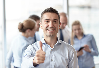 Image showing group of smiling businesspeople meeting in office