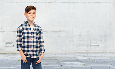 Image showing smiling boy in checkered shirt and jeans