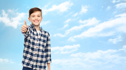 Image showing smiling boy in checkered shirt showing thumbs up