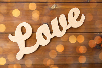 Image showing close up of word love cutout on wood