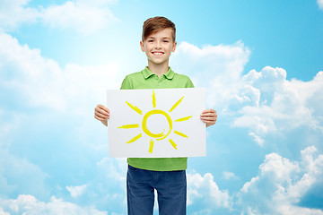 Image showing happy boy holding drawing or picture of sun