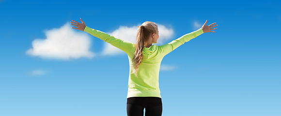 Image showing happy sporty woman enjoying sun and freedom