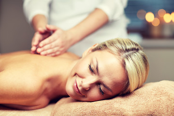 Image showing close up of woman lying and having massage in spa