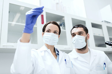 Image showing young scientists making test or research in lab