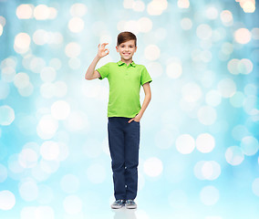 Image showing happy boy in white t-shirt showing ok hand sign