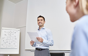 Image showing smiling business people meeting in office