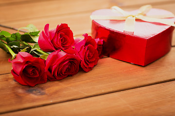 Image showing close up of heart shaped gift box and red roses