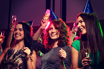 Image showing smiling friends with glasses of champagne in club