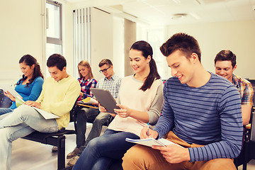 Image showing group of smiling students with tablet pc