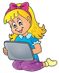 Image showing Girl playing with tablet