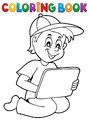 Image showing Coloring book boy playing with tablet