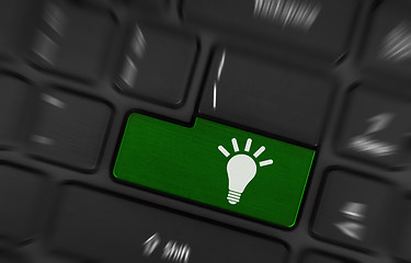 Image showing Laptop keyboard with light bulb symbol