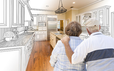 Image showing Senior Couple Looking Over Custom Kitchen Design Drawing and Pho