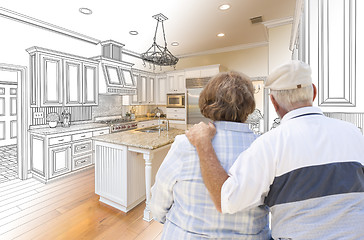 Image showing Senior Couple Looking Over Custom Kitchen Design Drawing and Pho