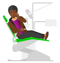 Image showing Man suffering in dental chair.