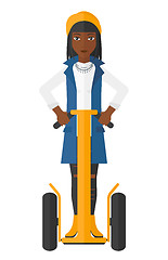 Image showing Woman riding on segway.