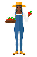 Image showing Farmer collecting apples.