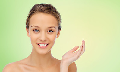 Image showing smiling young woman face and shoulders