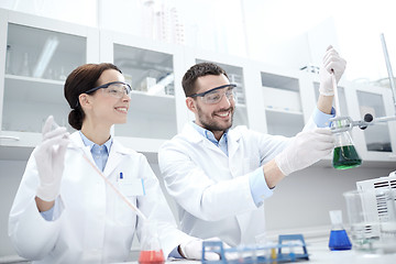 Image showing young scientists making test or research in lab