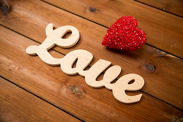 Image showing close up of word love with red heart decoration