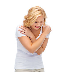 Image showing unhappy woman suffering from pain or violence