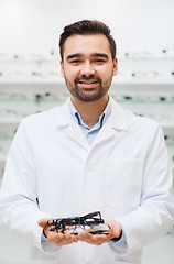 Image showing man optician with glasses in coat at optics store