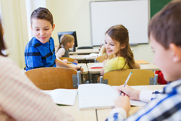 Image showing group of school kids writing test in classroom