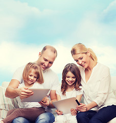 Image showing happy family with tablet pc computers