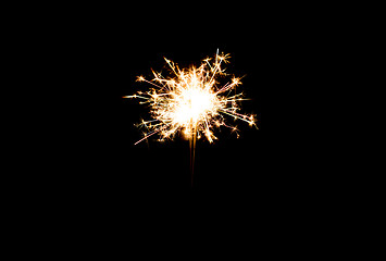 Image showing sparkler or bengal light burning over black