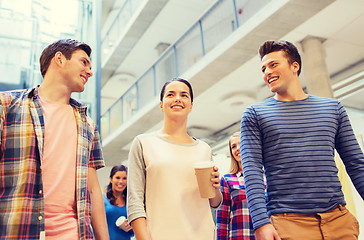 Image showing group of smiling students with paper coffee cups