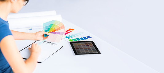 Image showing woman working with color samples for selection