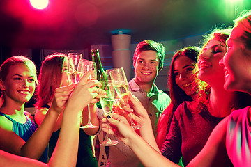 Image showing smiling friends with wine glasses and beer in club