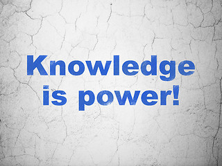 Image showing Studying concept: Knowledge Is power! on wall background