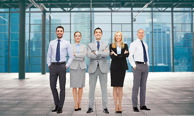 Image showing group of smiling businesspeople over office room