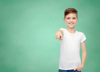 Image showing happy boy in white t-shirt pointing finger to you