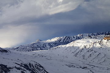 Image showing Winter mountains at evening and sunlight clouds