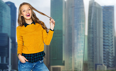 Image showing happy young woman or teen girl over city