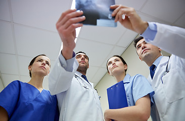 Image showing group of doctors looking at x-ray scan image