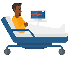 Image showing Patient lying in bed with heart monitor.