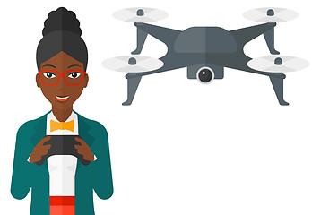 Image showing Woman flying drone.