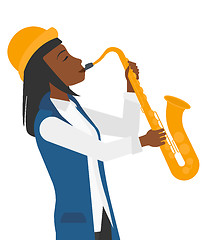 Image showing Woman playing saxophone.