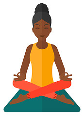 Image showing Woman meditating in lotus pose.