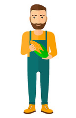 Image showing Farmer holding corn.