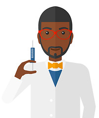 Image showing Doctor holding syringe.