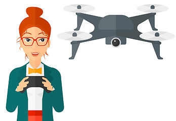 Image showing Woman flying drone.