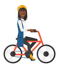 Image showing Woman riding bicycle.