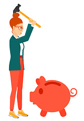 Image showing Woman breaking piggy bank.