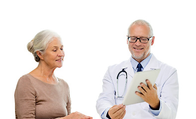 Image showing smiling senior woman and doctor with tablet pc