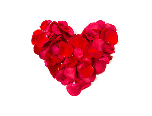 Image showing close up of red rose petals in heart shape