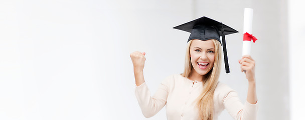 Image showing student in graduation cap with certificate